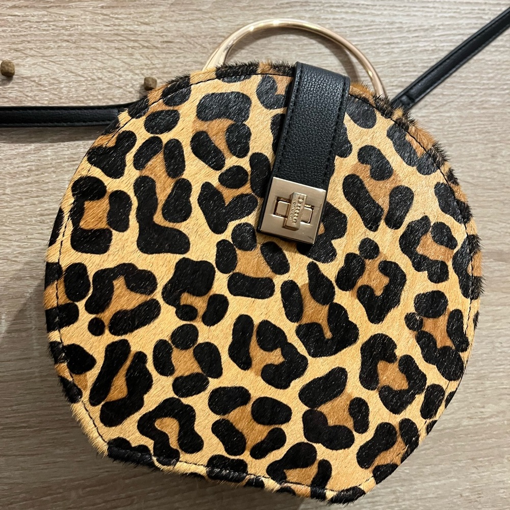 This is a cute, leopard print purse.  Purse has a strap that is adjustable